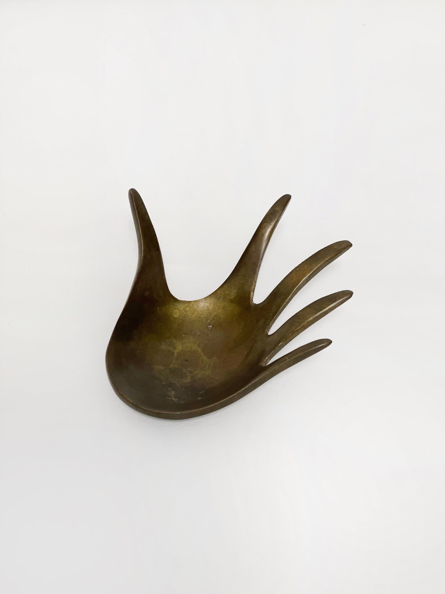 Brass hand shaped ashtray