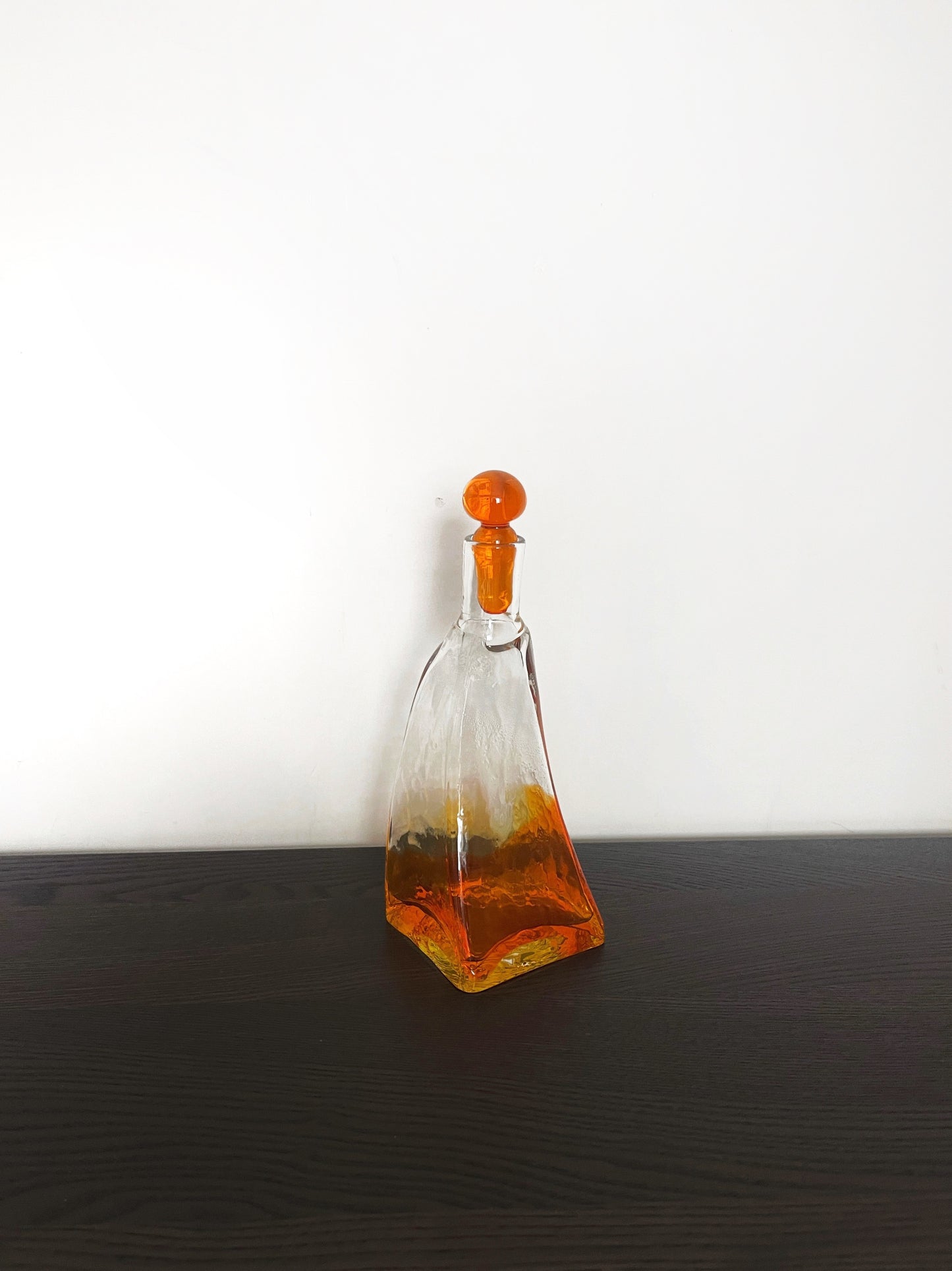 Irregular shaped glass decanter with stopper