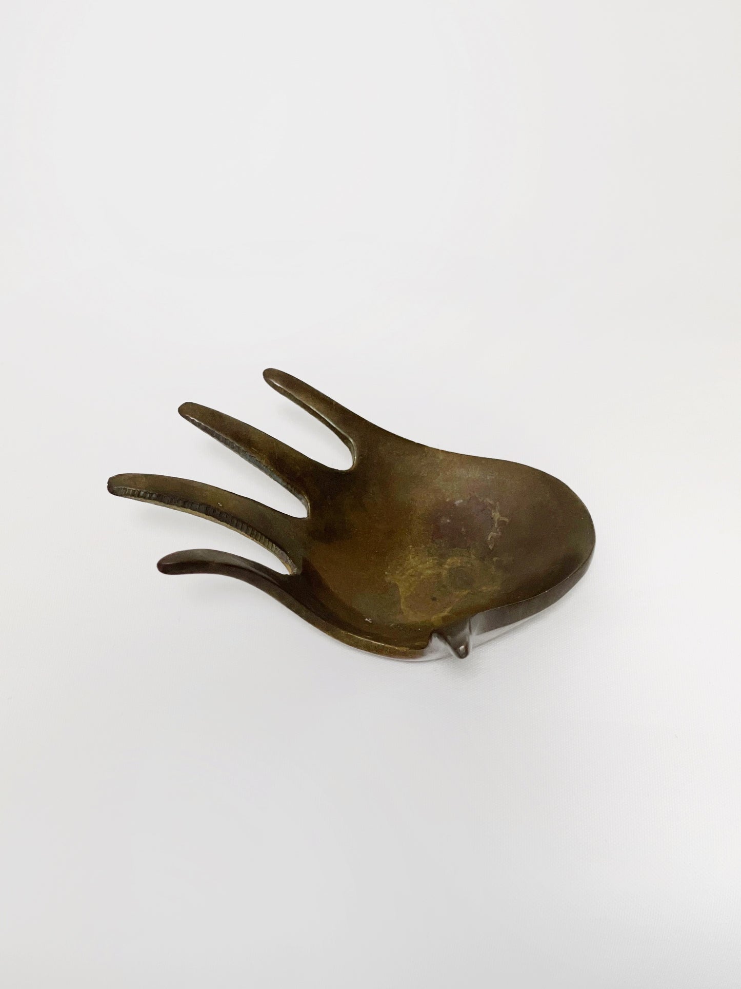 Brass hand shaped ashtray