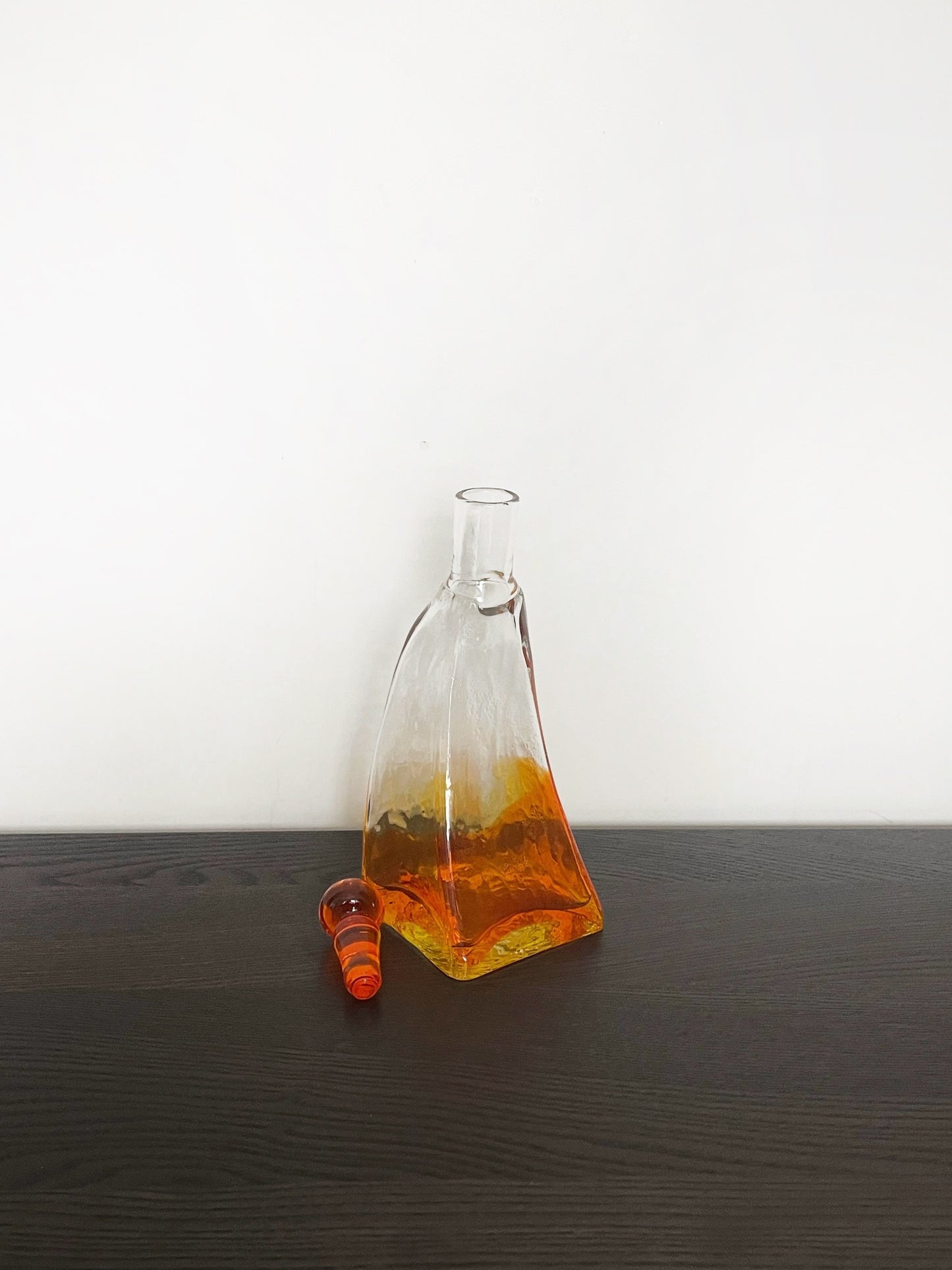 Irregular shaped glass decanter with stopper
