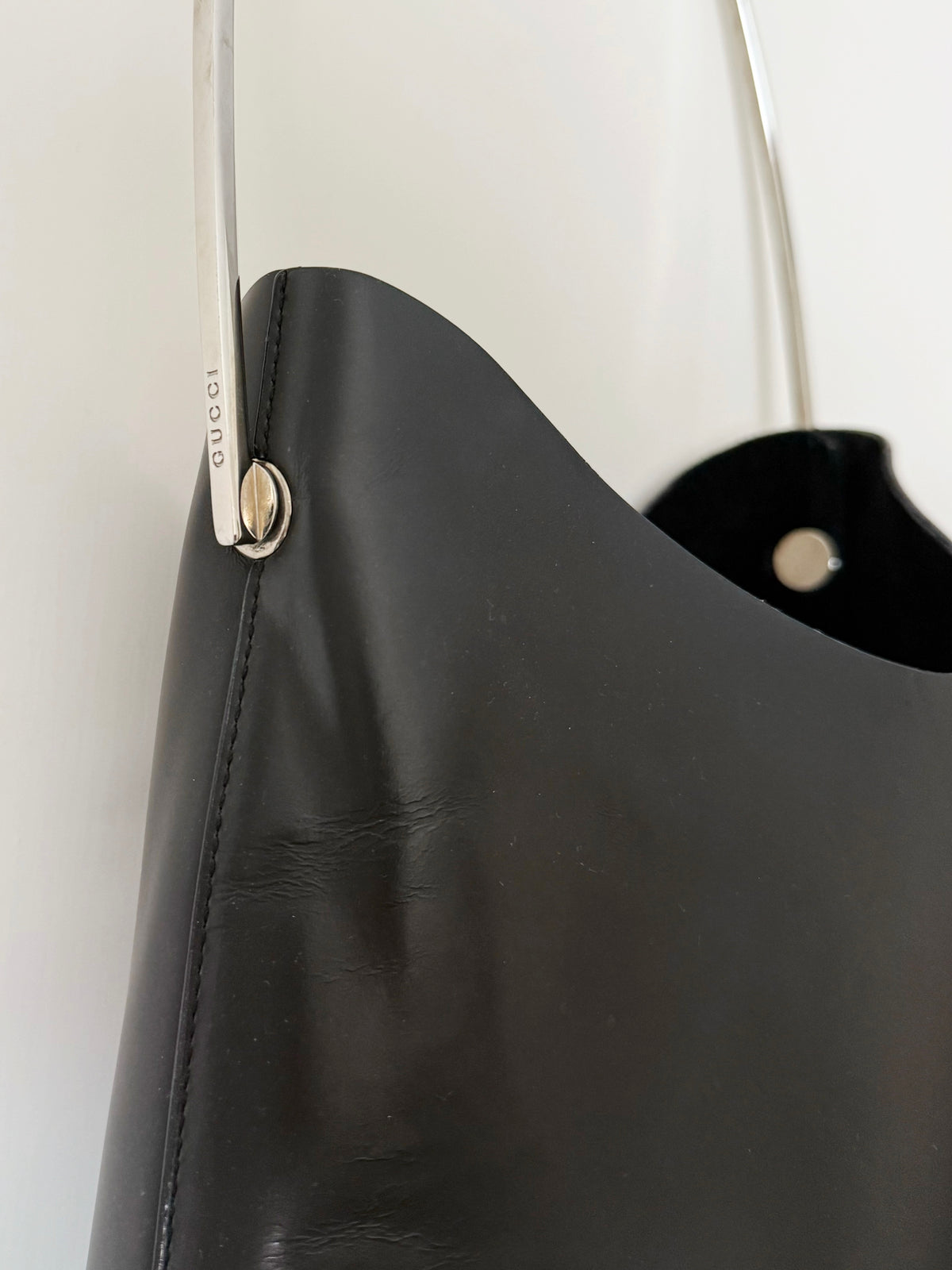03. Gucci leather bag with metal handle