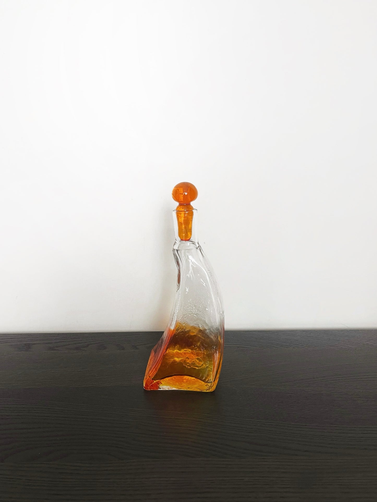 Irregular shaped glass decanter with stopper