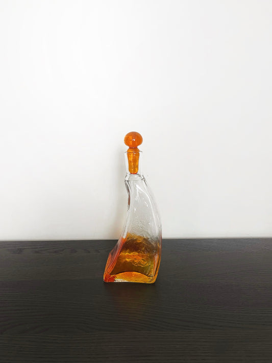 Irregular shaped glass decanter with stopper