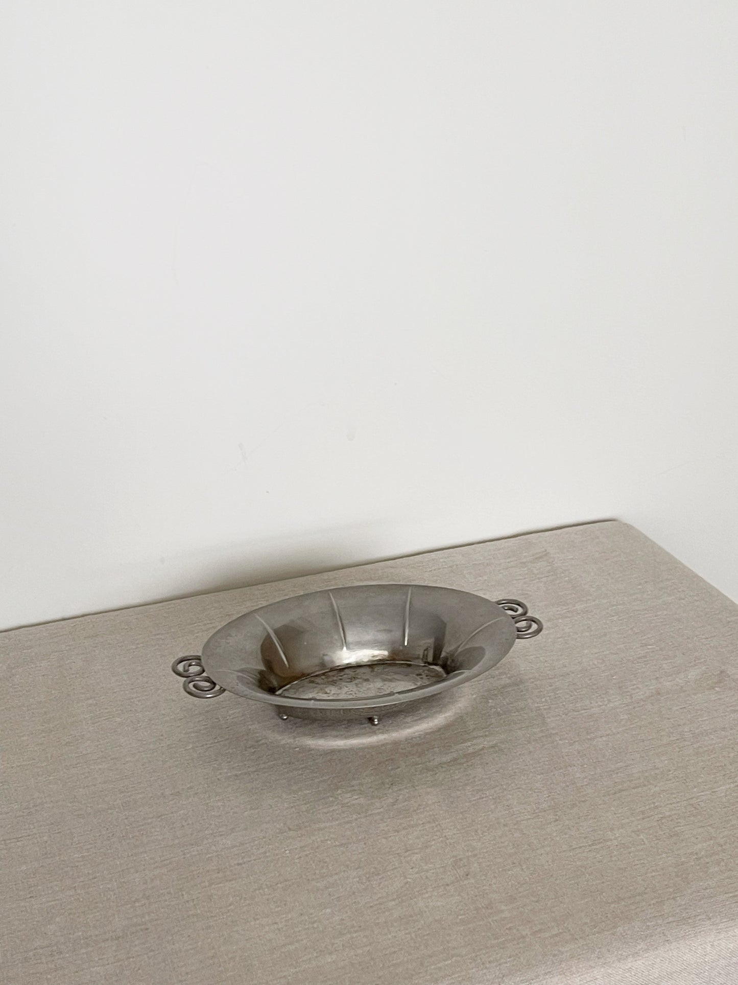 01. Pewter dish with spiral handles