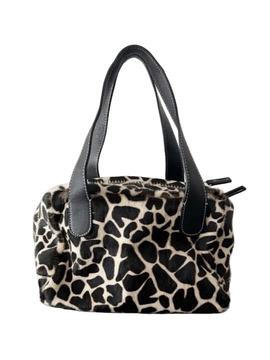 03. Guia’s giraffe print pony hair bowling bag