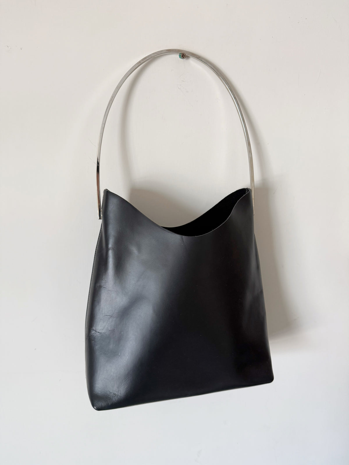 03. Gucci leather bag with metal handle