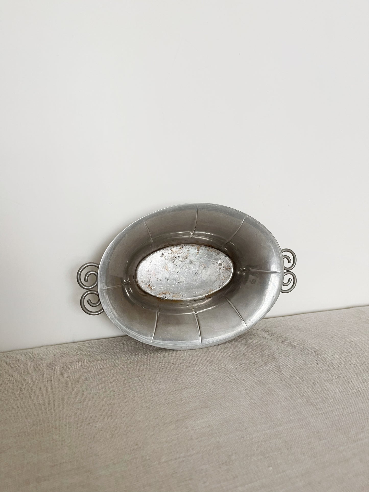 01. Pewter dish with spiral handles