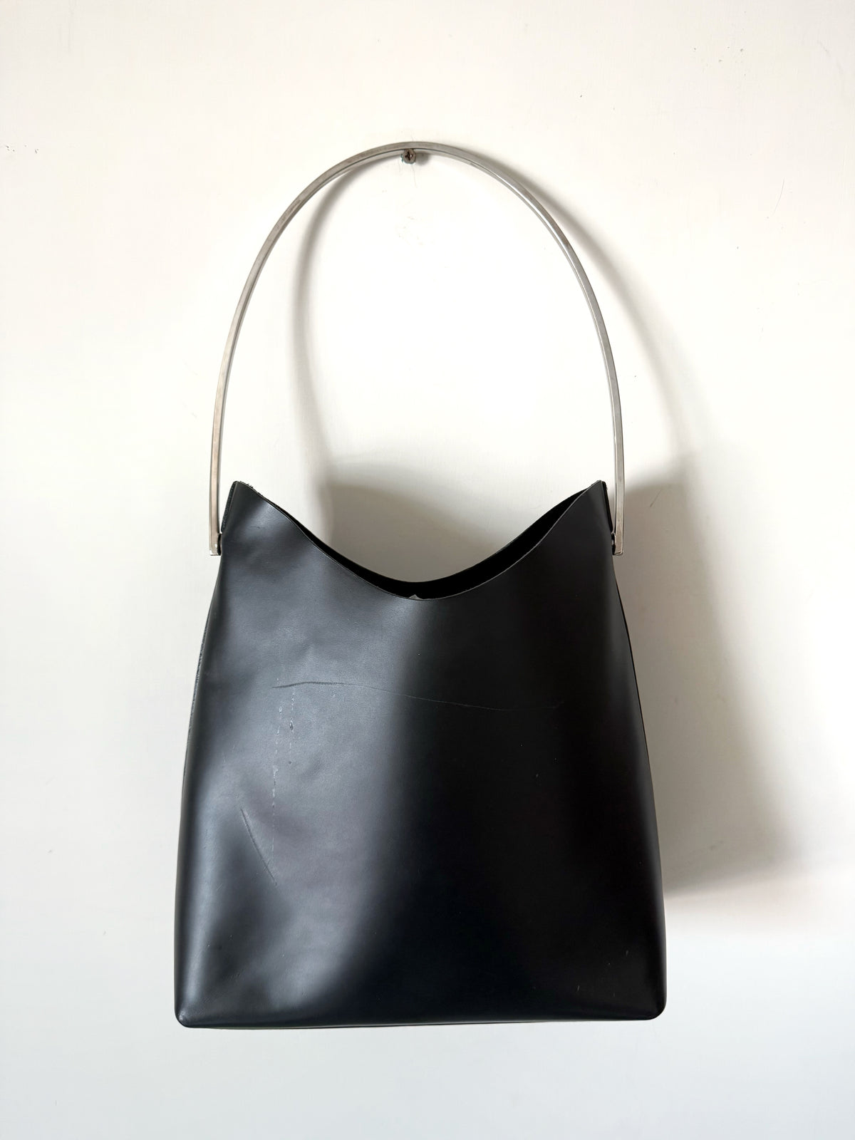 03. Gucci leather bag with metal handle