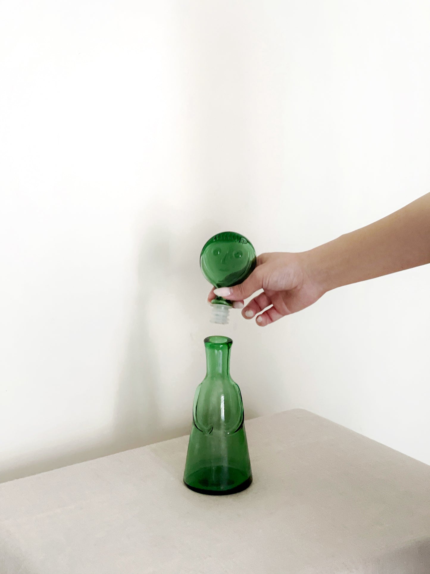 Erik Höglund green face decanter with face stopper