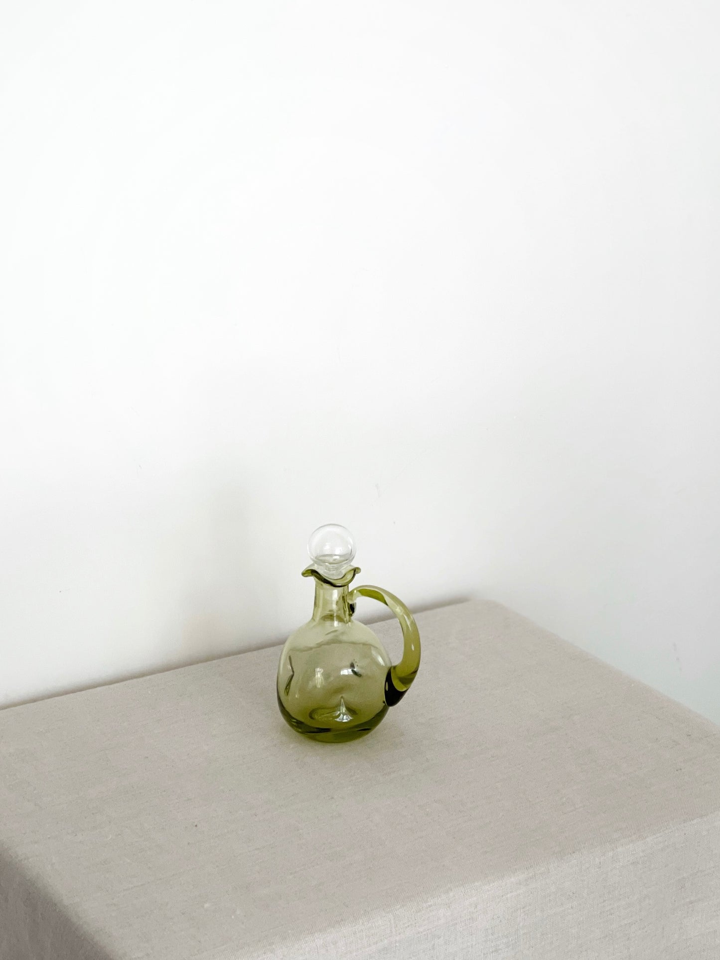 Handblown green pinched glass cruet with clear glass stopper